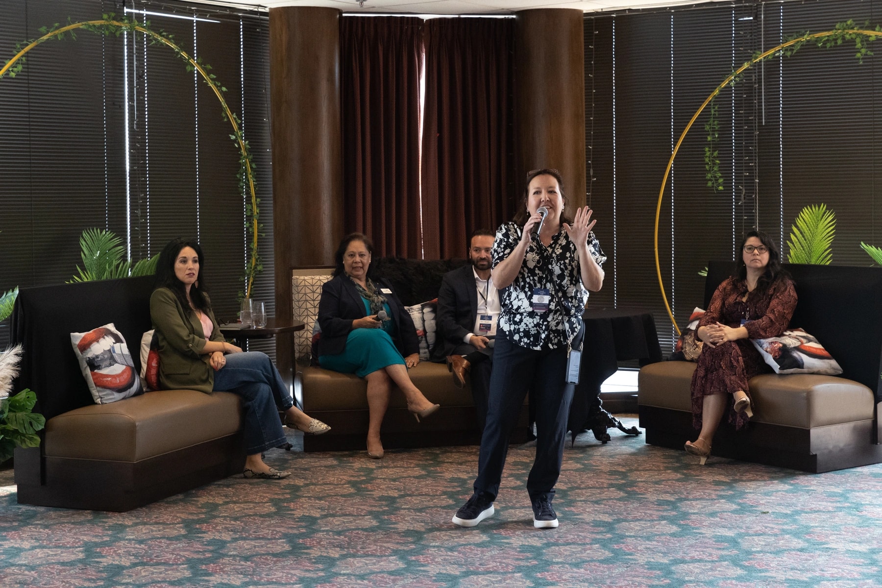 Monica Talan speaking during a panel discussion
